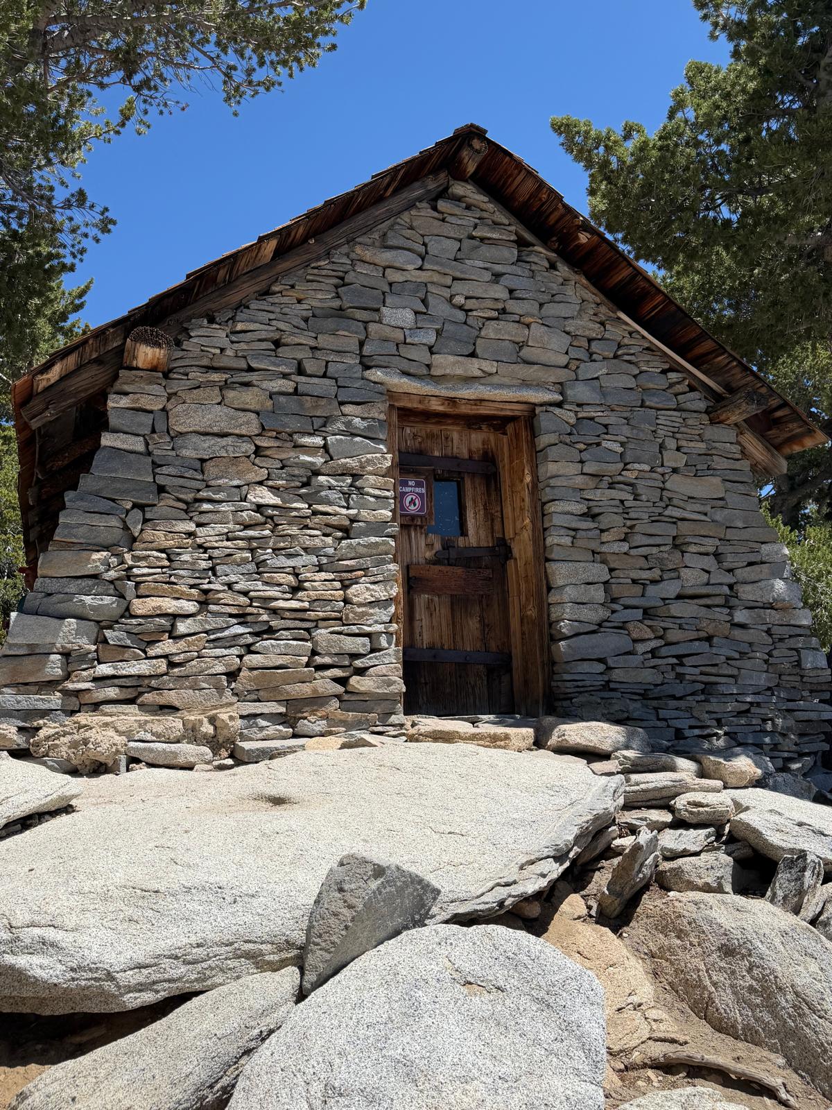 The stone hut below the summit